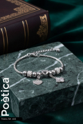 Pulsera de acero inoxidable con dijes de corazón y trébol