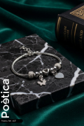 Pulsera de acero inoxidable con mariposa y corazones